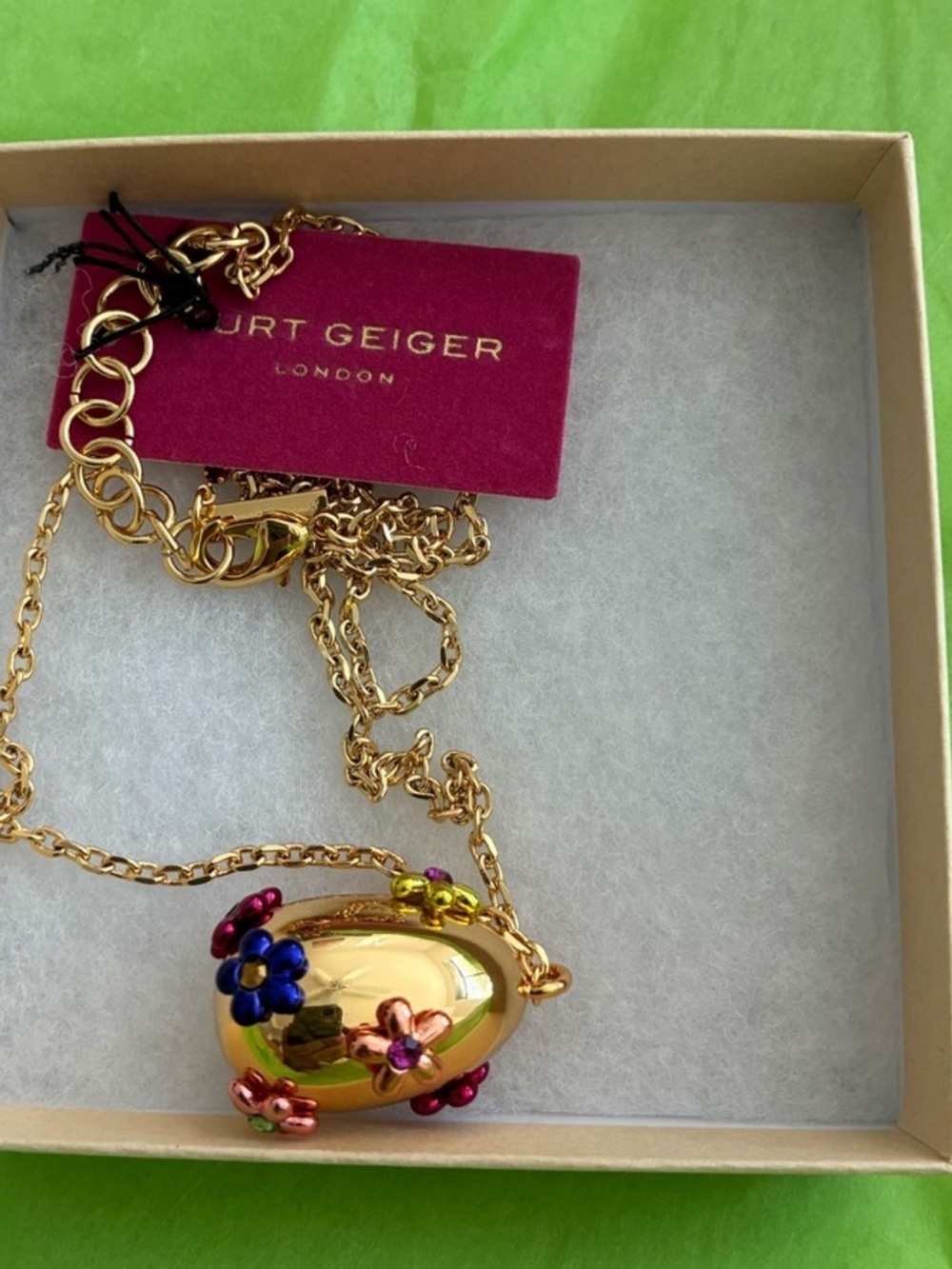 Kurt Geiger Gold Egg Pendant Necklace with Multicolor Flower Charms